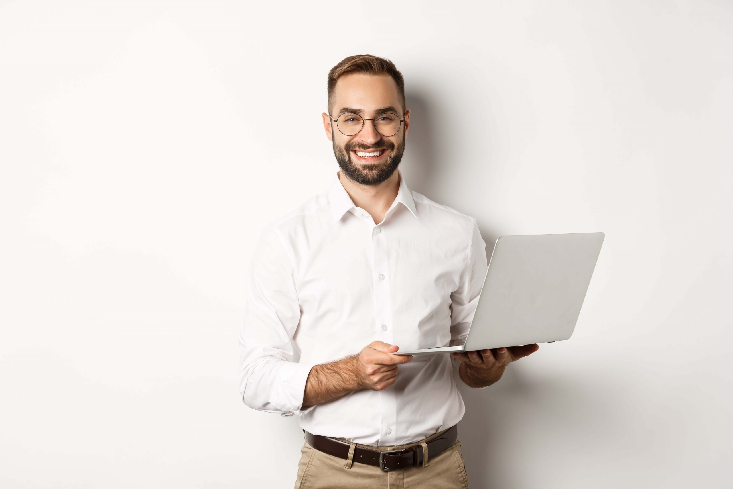 business-sucessful-businessman-working-with-laptop-using-computer-and-smiling-standing-scaled